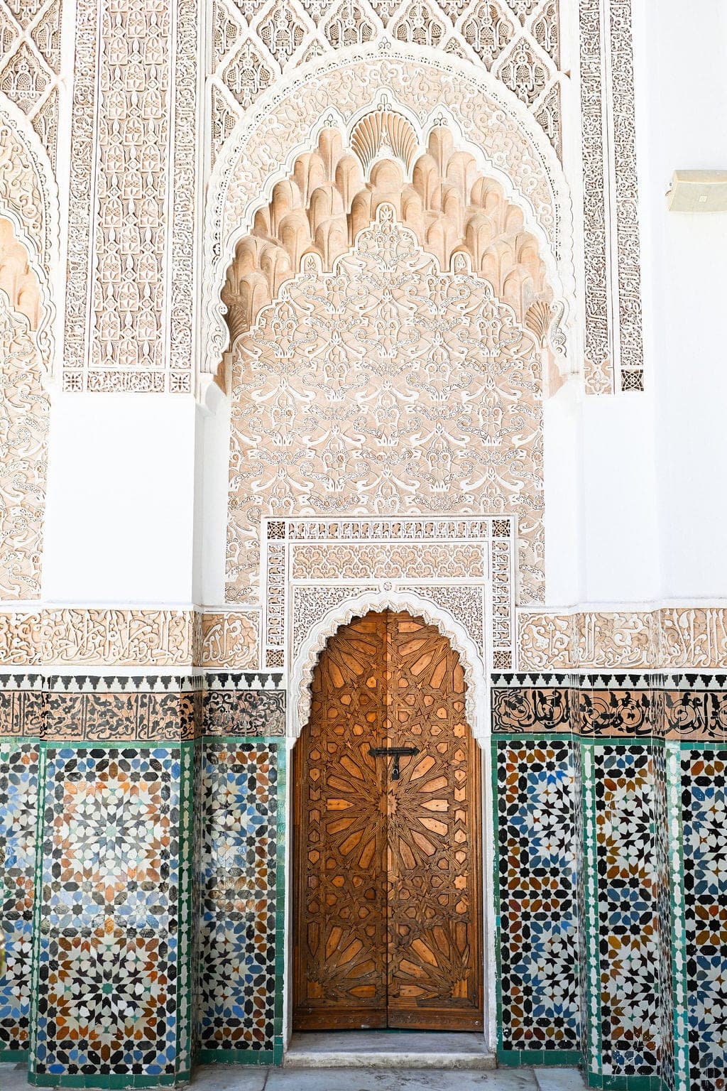Carved wooden door and zellige tilework