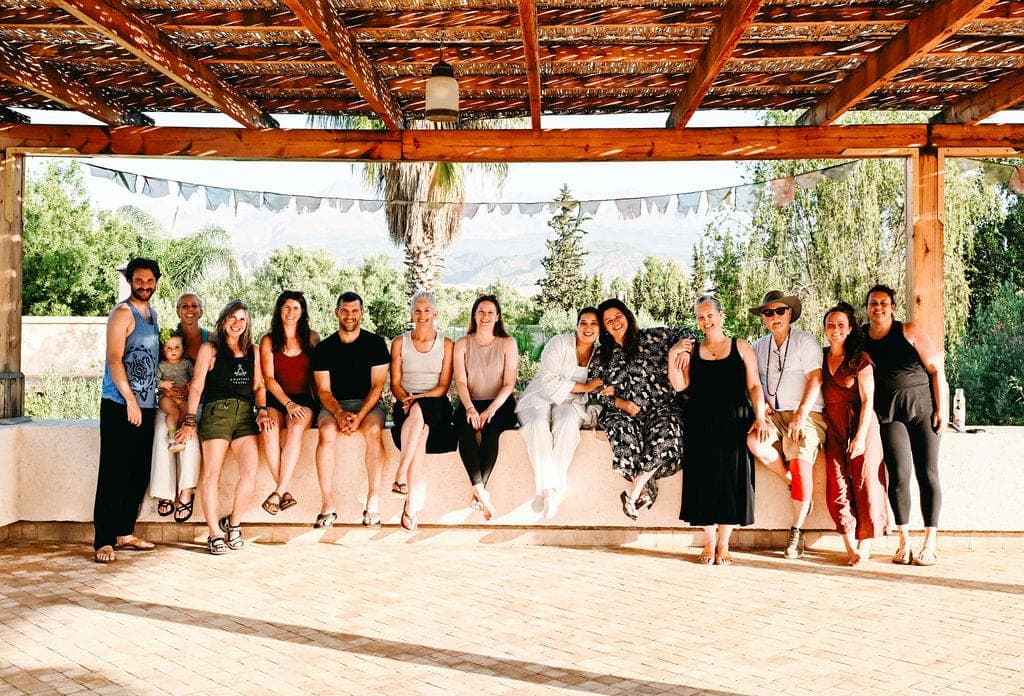 Retreat group under a pergola in Morocco